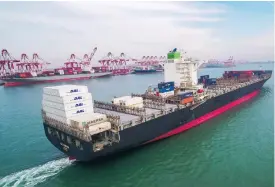  ?? (AFP) ?? A cargo ship is seen at a port in Qingdao in China’s eastern Shandong province