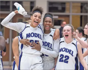  ?? Steven Eckhoff / RN-T ?? Model’s Victaria Saxton (from left), Megan Kent and Montana Moats celebrate after the Lady Blue Devils defeated Putnam County 70-64 in the first round of the Class AA state playoffs Friday at Model High School.