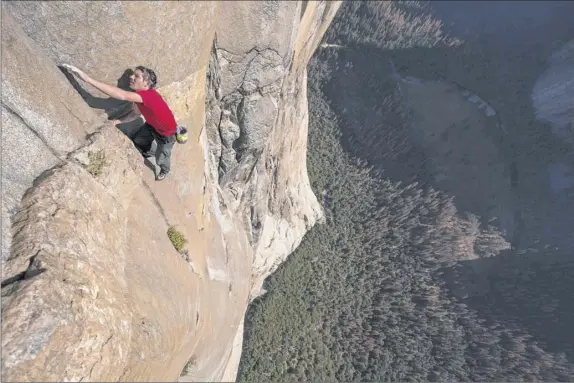  ?? AFP Photo / National Geographic / Jimmy Chin ?? This handout photo obtained October 3, 2018, courtesy of National Geographic, shows Alex Honnold free solo climbing on El Capitan’s Freerider in Yosemite National Park, becoming the first person to climb El Capitan without a rope.