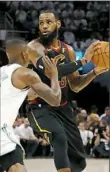  ?? Gregory Shamus/Getty Images ?? LeBron James looks to pass under pressure from the Boston Celtics’ Terry Rozier Friday night in Cleveland.