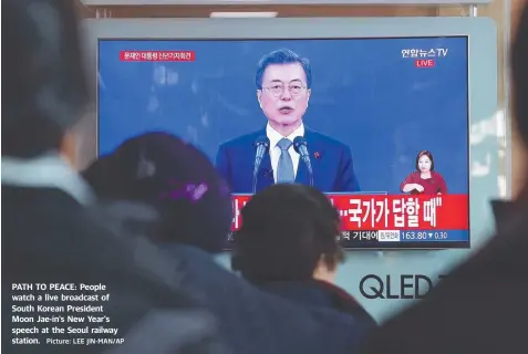  ?? Picture: LEE JIN-MAN/AP ?? PATH TO PEACE: People watch a live broadcast of South Korean President Moon Jae-in's New Year's speech at the Seoul railway station.