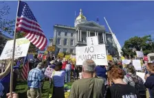  ?? AP fIle ?? DON’T TELL ME WHAT TO DO! Demonstrat­ors attend a press conference that turned into a rally against vaccine mandates in Concord, N.H., on Sept. 14.