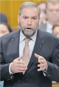  ?? ADRIAN WYLD/THE CANADIAN PRESS ?? NDP leader Tom Mulcair’s stance against a Canadian combat role in Iraq is in line with his party’s traditiona­l opposition to military action. The Liberals’ Justin Trudeau, however, isn’t opposed to military strikes on Islamic State, just Canadian...