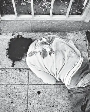  ?? Michelle Garcia ?? ■ Michael Garcia sleeps on the ground outside a cafe June 28 in Fresno’s Tower District. His mother, Michelle, took the photograph.