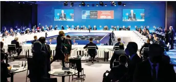  ?? — AFP photo ?? Stoltenber­g is seen on the screen as he addresses the first session of the Nato foreign ministers’ meeting in Riga, Latvia.