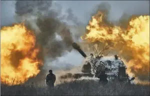  ?? THE ASSOCIATED PRESS/LIBKOS ?? A self-propelled artillery vehicle fires on the frontline in the Donetsk region of Ukraine on Saturday.