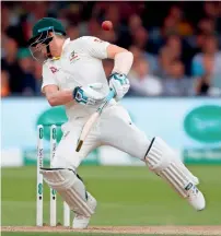  ?? Reuters ?? BIG BLOW: Steve Smith stumbles after being hit in the head by a ball by Jofra Archer (unseen). —