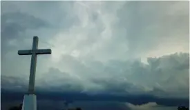  ?? AP PHOTO/MORRY GASH ?? Storm clouds approach a church in Mequon, Wis., in 2020.