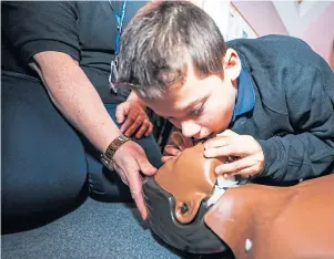  ?? Picture: Steve Brown. ?? A youngster learns CPR skills at St Andrew’s First Aid Group.