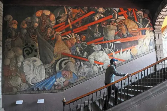  ?? ?? a mural by Jean Charlot titled, Massacre en el Templo Mayor, illustrati­ng the 1521 massacre that the Spaniards led in the most sacred site of the aztec empire, at the former Jesuit college antiguo Colegio de San Ildefonso in Mexico City.