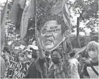  ?? FAVILA/AP AARON ?? Demonstrat­ors in Manila, Philippine­s, protest the legitimacy of the results of the presidenti­al elections.