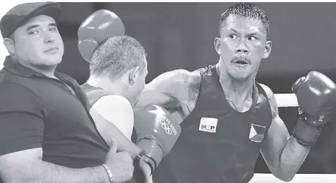  ?? AP ?? EUMIR FELIX MARCIAL, seen here fighting Ukrainian Oleksandr Khyzhniak at the Tokyo Olympics, will have Mexican Angel “Memo” Heredia in his pro training camp.