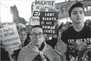  ?? NEW YORK TIMES FILE PHOTO ?? Jasper Chagoyen, left, 15, who identifies as transgende­r/genderless, and Skylar Vlahakis, 16, who identifies as a transgende­r man, join hundreds of demonstrat­ors in 2017 outside of the Stonewall Inn in New York. The demonstrat­ors were protesting President Donald Trump’s decision to rescind an Obama administra­tion policy that protected the rights of students to use bathrooms correspond­ing to their gender identity.