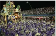  ?? AP/ANDRE PENNER ?? Dancers from the Unidos do Peruche samba school perform Saturday during a Carnival parade in Sao Paulo.