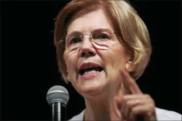  ?? CHARLES KRUPA — THE ASSOCIATED PRESS FILE ?? In this Wednesday file photo, U.S. Sen. Elizabeth Warren, D-Mass., speaks during a town hall-style gathering in Woburn, Ma. A DNA analysis done on Sen. Warren provides strong evidence she has Native American heritage. She provided her test results to The Boston Globe for a story published Monday.