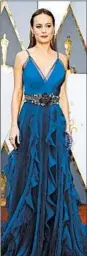  ?? MIKE NELSON/EPA ?? Brie Larson takes on romantic wearing a deep violet Gucci dress.