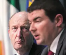  ??  ?? Transport Minister Shane Ross (left) listens to Junior Minister Brendan Griffin during a Budget press briefing