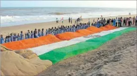  ??  ?? Sand artist Sudarsan Pattnaik with some of his creations