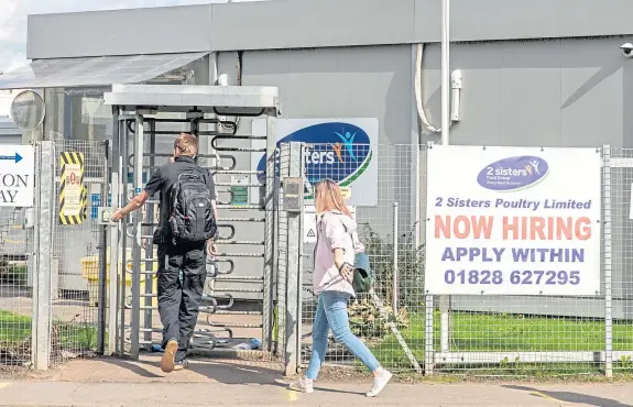  ?? Picture: Steve Brown. ?? Workers return to the 2 Sisters Factory in Coupar Angus on the first day of opening since Covid closed it down.