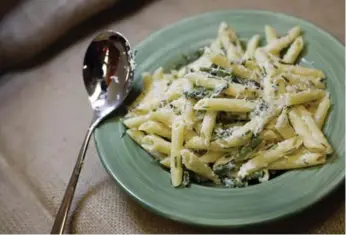  ?? COLE BURSTON/TORONTO STAR ?? Goat cheese melts into cooked asparagus and pasta.