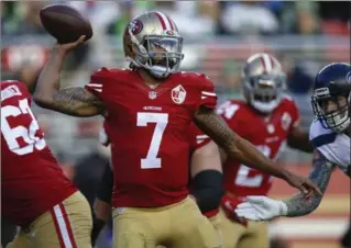  ?? BAY AREA NEWS GROUP FILE PHOTO ?? San Francisco 49ers’ Colin Kaepernick throws against Seattle last season. The controvers­ial QB is a free agent.