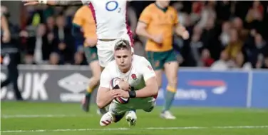  ?? Agence France-presse ?? ↑
England’s Freddie Steward dives over the line to score the opening try against Australia during their friendly match in London on Saturday.