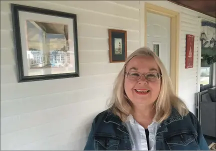  ?? BILL DEBUS - THE NEWS-HERALD ?? Karen Bidlack poses for a photo on March 18at her home in Fairport Harbor Village. Bidlack is the first women to serve as president of the Fairport Men’s Civic Club in the group’s 85-year history.