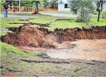  ?? SEAN WHALEN PHOTOGRAPH­Y ?? The sinkhole in Oxford, N.S., is continuing to grow and is being monitored by geologists.