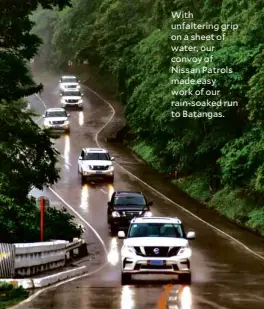  ??  ?? With unfalterin­g grip on a sheet of water, our convoy of Nissan Patrols made easy work of our rain-soaked run to Batangas.