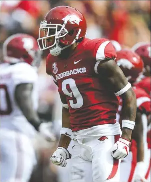  ?? NWA Democrat-Gazette/Charlie Kaijo ?? NOT BACKING DOWN: Arkansas defensive back Santos Ramirez (9) reacts after stripping the ball from Alabama Crimson Tide running back Najee Harris (22) Saturday during the second quarter of the Razorbacks’ 65-31 loss at Donald W. Reynolds Razorback Stadium in Fayettevil­le.