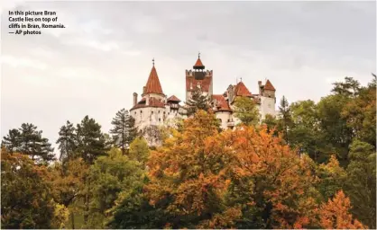  ?? — AP photos ?? In this picture Bran Castle lies on top of cliffs in Bran, Romania.