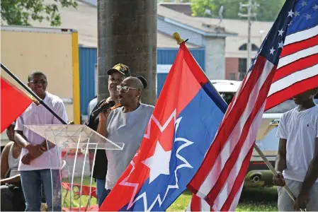  ?? The Sentinel-Record/Lance Brownfield ?? ■ Carolyn Hughes sings the first verse of “Lift Every Voice and Sing,” during Saturday’s Juneteenth celebratio­n at the Hot Springs Farmers and Artisans Market.