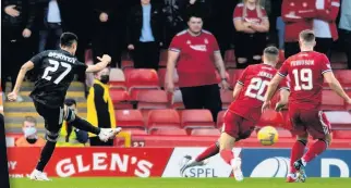  ??  ?? POINT MADE Dons boss Stephen Glass, left, as Bayramov, above, nets the opener for visitors