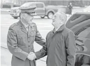  ?? Alex Brandon / Associated Press ?? Chairman of the Joint Chiefs of Staff Gen. Joseph Dunford, left, greets Secretary of Defense James Mattis on Saturday as Mattis arrives at the Pentagon.