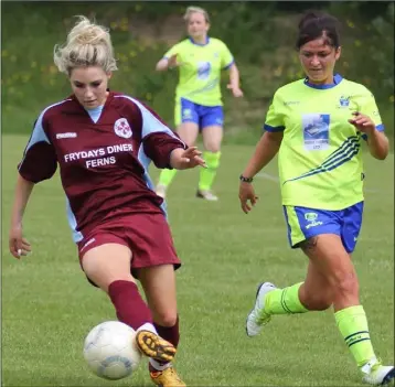  ??  ?? Ferns United captain Leona Breen controls the ball as Adamstown’s Danielle Martin keeps a close watch.