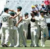  ?? Photo: AFP ?? Australian players celebrate their victory in Melbourne.
