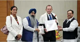  ?? ANI ?? BJP president J.P. Nadda (right) meets ex Australian PM Tony Abbott in New Delhi on 4 March.