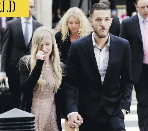  ?? MATT DUNHAM/THE ASSOCIATED PRESS ?? Connie Yates, left, and Chris Gard, parents of critically ill baby Charlie Gard, arrive at the High Court in London on Monday, where they announced an end to their highly publicized bid to keep their son alive.