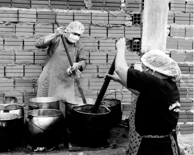  ?? AP ?? In this May 11, 2020 photo, Walter Ferreira (left) and Laura Dure cook stew at a soup kitchen that feeds about 300 people daily in Luque, Paraguay.