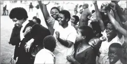  ?? PICTURE: ALF KUMALO/AFRICAN NEWS AGENCY (ANA) ARCHIVES ?? HEART OF THE PEOPLE: Winnie Madikizela-Mandela, left, laughs as she is given a heroine’s welcome on returning to Brandfort to assess the damage to her home caused by fire, in 1985. The residents wept when she later left the township for Johannesbu­rg.