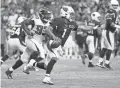  ??  ?? Cardinals quarterbac­k Kyler Murray (1) scrambles and directs blockers against the Falcons during the fourth quarter on Sunday in Glendale.