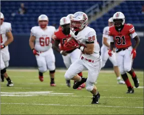  ?? TIM PHILLIS — FOR THE NEWS-HERALD ?? Mentor’s Mitchell Waite carries in the open field Aug. 21at Canton McKinley.