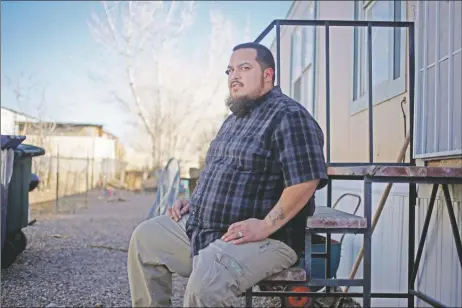  ?? LUIS SÁNCHEZ SATURNO/The New Mexican ?? Joshua Acuña works full time as an educationa­l assistant in Santa Fe Public Schools. He’s working toward getting a teaching degree, but he says his low pay is a major barrier.