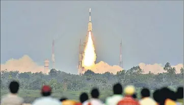  ?? AFP ?? ■ People watch the successful launch of Isro’s communicat­ion satellite, GSAT6A, a communicat­ion satellite, from the Satish Dhawan Space Centre in Andhra Pradesh’s Sriharikot­a on Thursday.