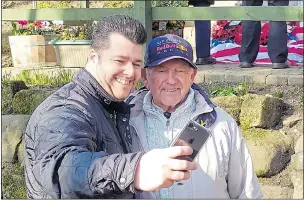  ??  ?? HERO: Tony Foulds has a selfie with a well-wisher at the Sheffield memorial