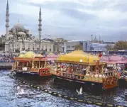  ??  ?? Lively Eminönü, where Bosphorus cruises start from, with the New Mosque in the background. The colorful boats are the kitchens of the food stalls nearby.