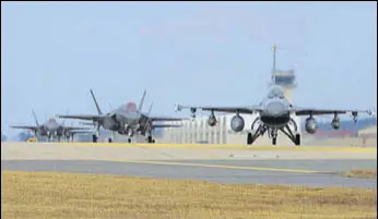  ?? AFP ?? US Air Force F16 Fighting Falcon (right) and F35A Lightning II fighter jets taxiing at Kunsan Air Base in South Korea’s southweste­rn port city of Gunsan.