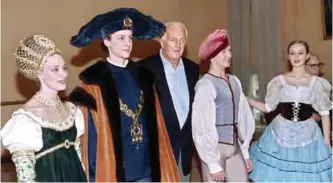  ??  ?? In this file photo taken on October 3, 1997 French fashion designer Hubert de Givenchy (center) poses for photograph­ers together with ballet artists in Bolshoy theatre in Moscow.