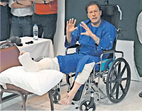  ?? ?? Imran Khan talks to the media outside hospital in Lahore after an assassinat­ion attempt on Nov 3 during his ‘long march’ near Wazirabad