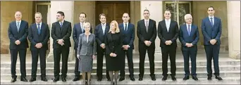  ??  ?? New ministers in front of the presidenti­al palace in South Nicosia